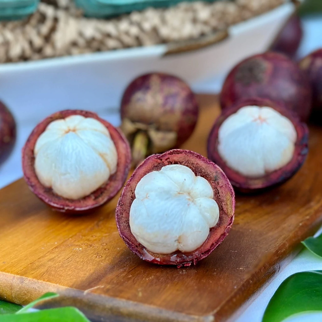 Opened mangosteen showing its soft white segments